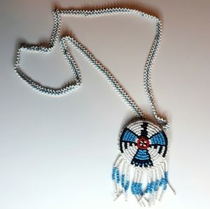 Vintage American Indian beaded necklace with Phoenix Pendant Blue white black
